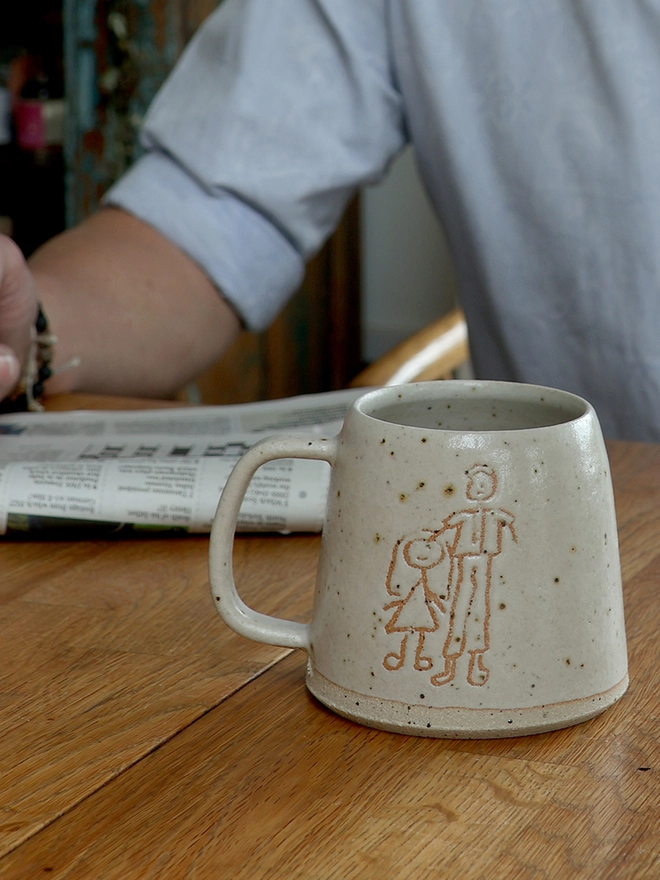 Childrens Drawing Handmade Ceramic Mug
 on table