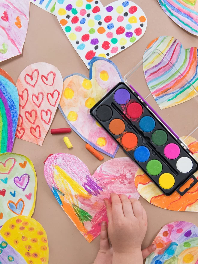 Create a 'love bomb' by painting lots of hearts