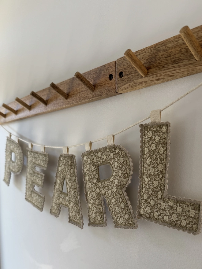 Fabric Letter Garland.  Green floral fabric letters hung on a cord 