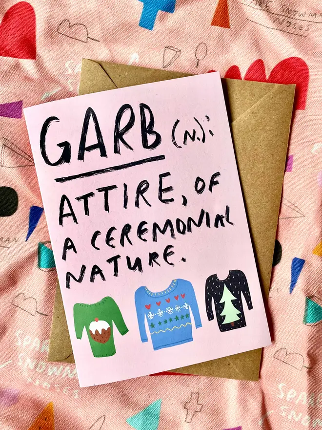 Card reads the definition of garb, and shows some xmas jumpers