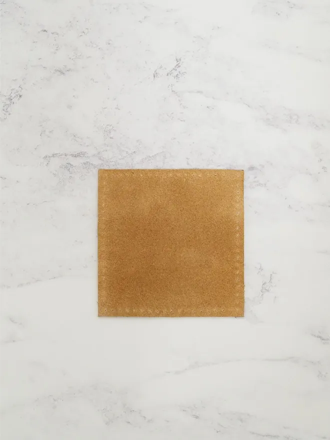 reverse of handmade leather coaster