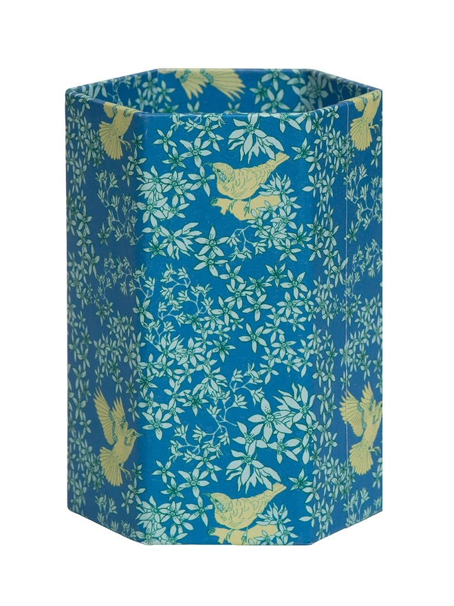 Corali Hexagonal Brush Pot, a colourful patterned pencil pot sitting on a white surface against a plain backdrop.