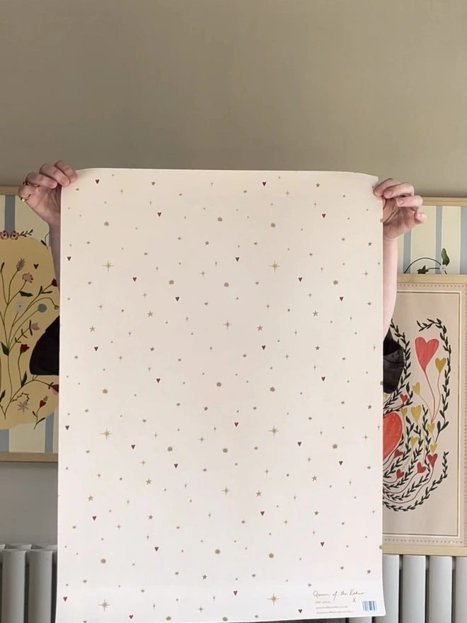 Astral Weeks Gift Wrap (3 Sheets), a person holding up a decorated wrapping paper. 