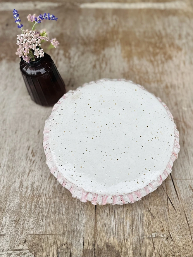 Cream and pink frilly cake stand