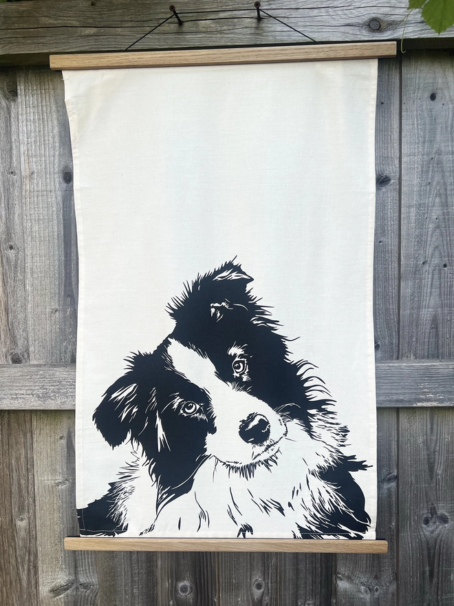 Full image of border collie dog tea towel with the collies head printed in the bottom half