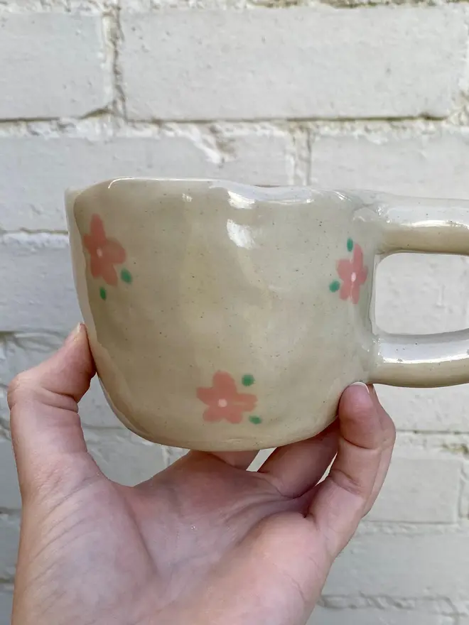 pink flower painted handmade ceramic smiley face mug