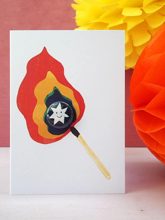 Flame and star greeting card with pin badge