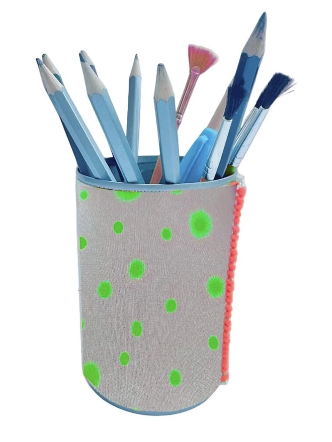 Upcycled & Repurposed Linen Tin Holder Polka Dot Print, a colourful polka dot tin on a white surface with pens and brushes in it. 