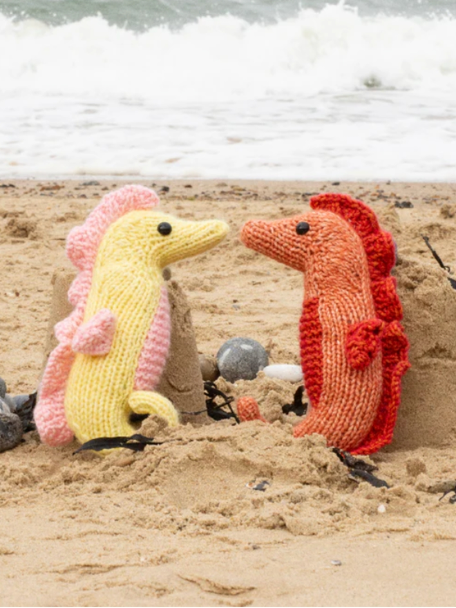 Seahorse Knit Kit. A knitted seahorse in orange and red.
