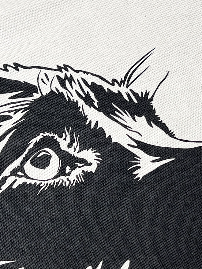 Close up of the eye and face printed on the tea towel