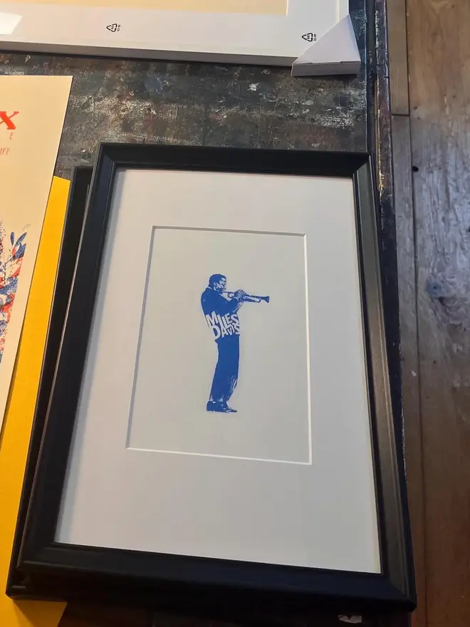 Miles Davis Risograph Print, in a black frame. 