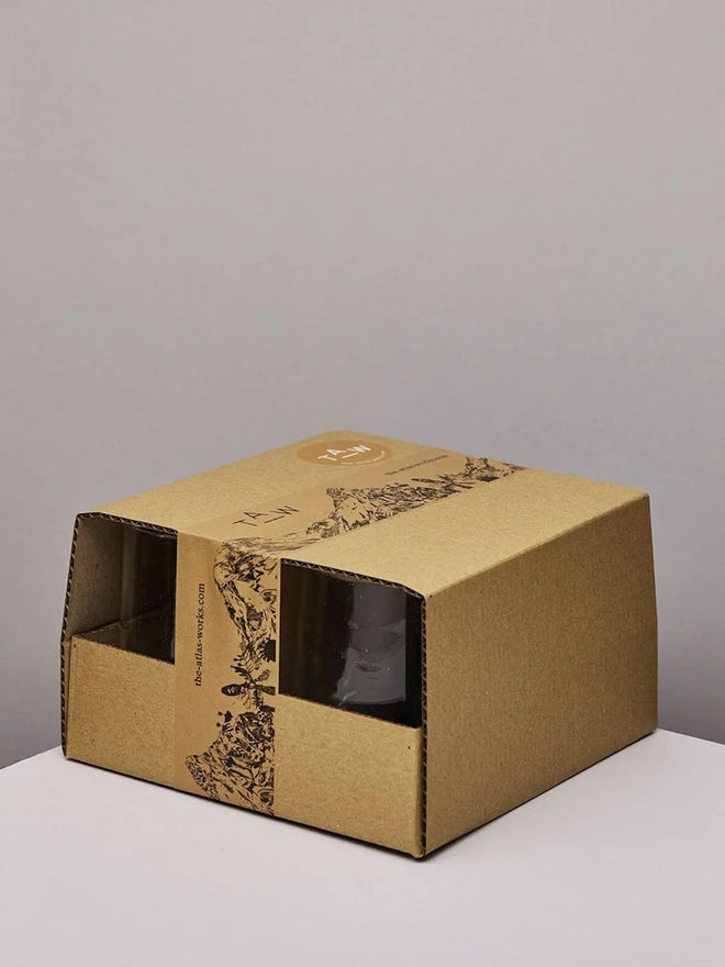 Tall Wine Glasses (Set Of 1 Or 4), group of a tall wine glasses sitting on a white counter top against a plain backdrop. They are packaged. 