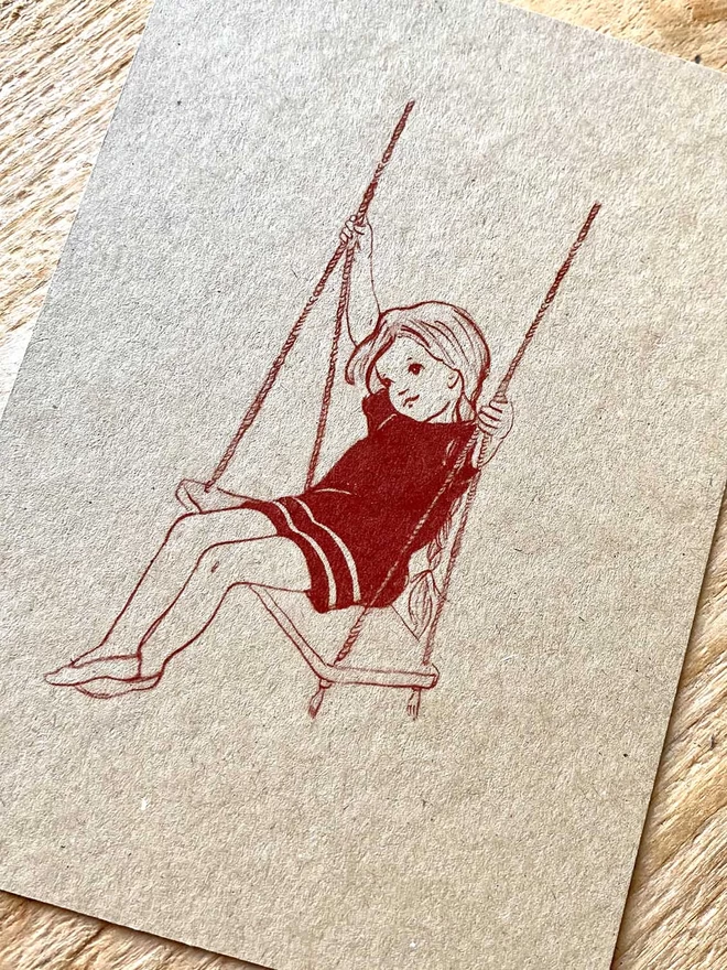 an A6 size postcard featuring a little girl printed in terracotta ink on kraft card