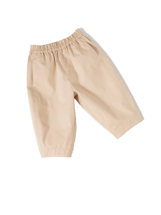 stylish uk kidswear brand oversized neutral swedish trousers made by studio koter, former COS duo