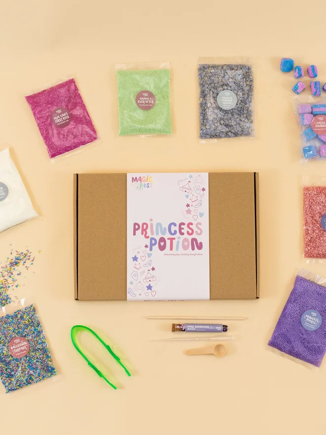 princess sensory potion kit. nine bags of various sensory materials placed around a cardboard box.