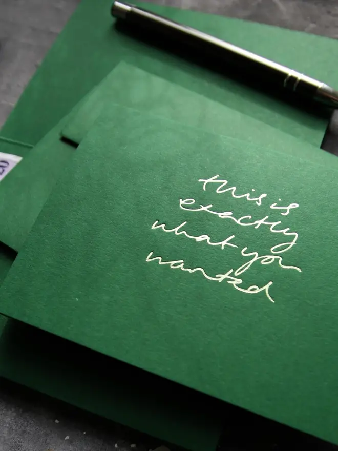 Hand foiled cash card or money wallet in a forest green colour handfoiled in shiny lime green text which says 'this is exactly what you wanted'.