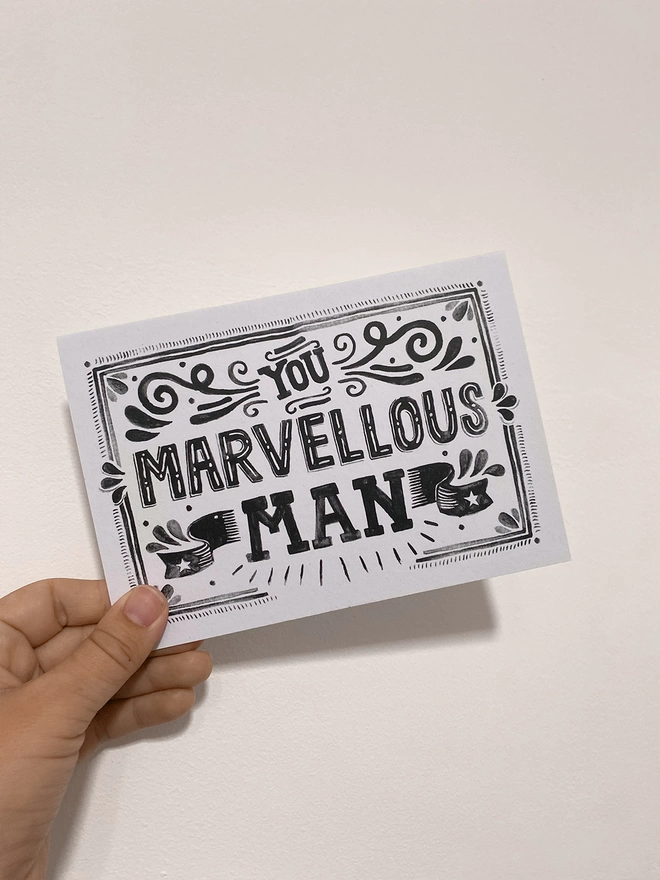 Marvellous man card in hand