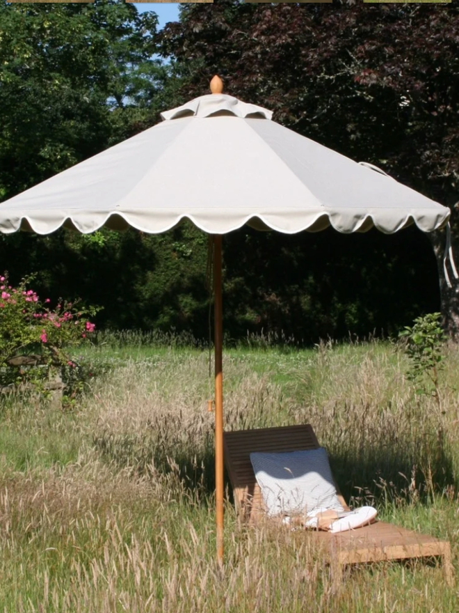 Beige Soft Scallop Parasol. A beige parasol.