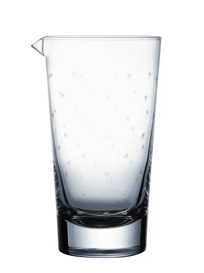 engraved stars crystal mixing glass. a crystal cocktail glass patterned with small stars.