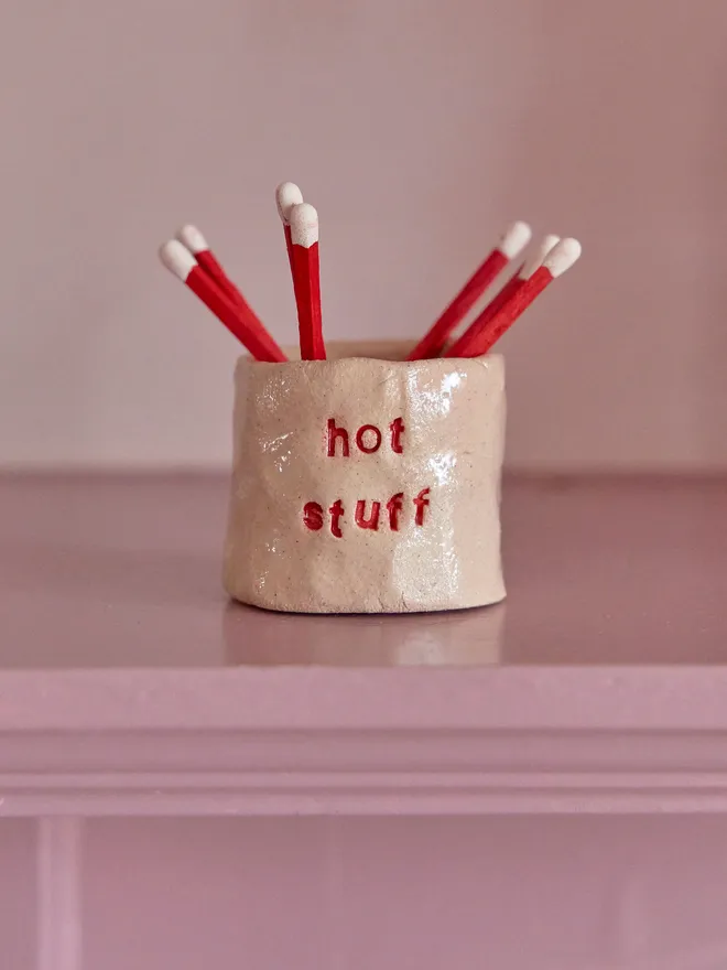 Ceramic Match Holder with the phrase 'Hot Suff' stamped into it 