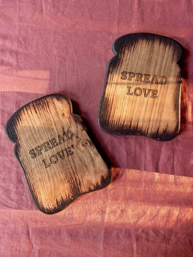 Spread love toast shaped serving board. A wooden toast shaped serving board with spread love engraved on the front