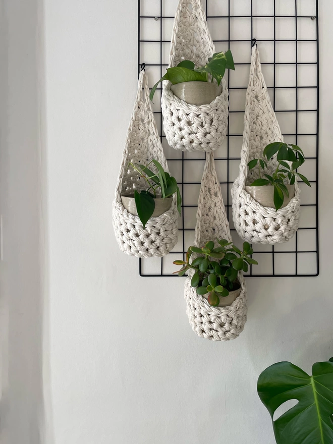 indoor large white cotton hanging wall planter, white fabric wall mounted plant holder, handmade crochet plant basket, handmade sustainable crochet decor, rustic natural organic homeware accessories, hanging plant pot holder