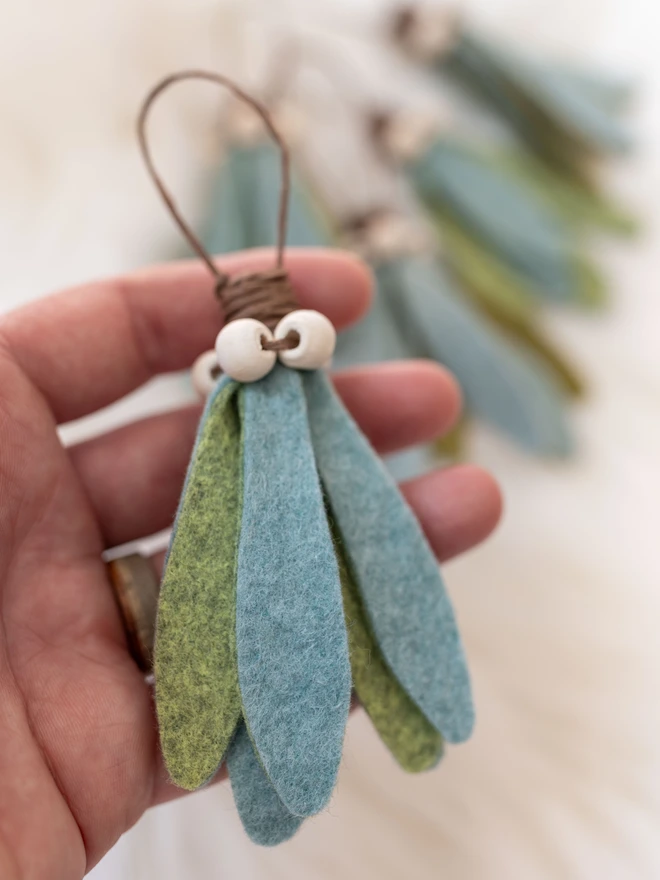 felt mistletoe decoaration with white wooden beads