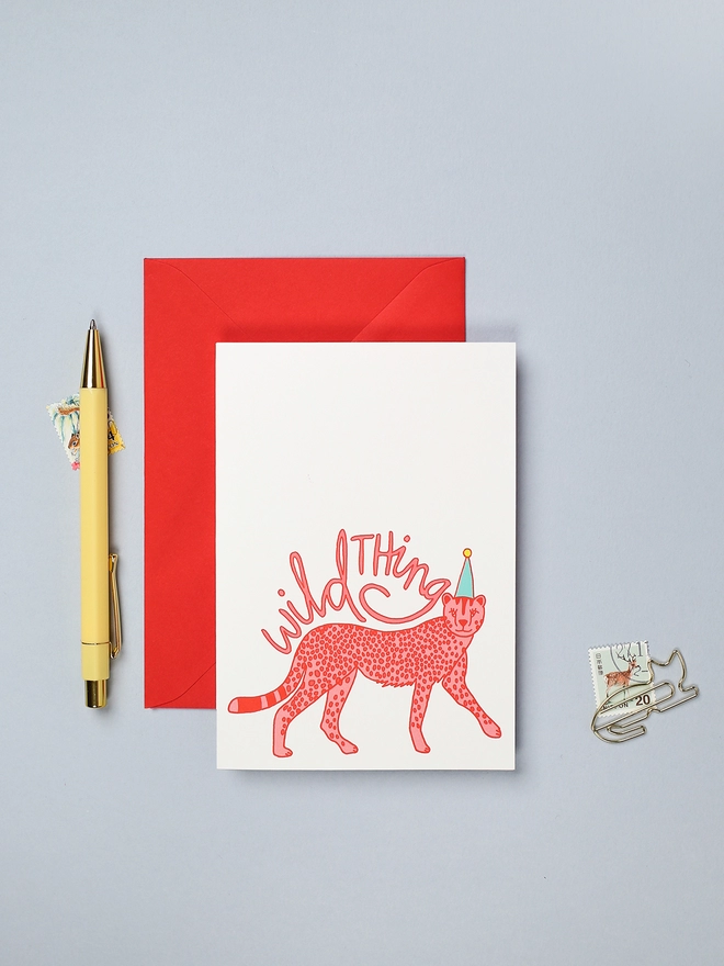 Bright and colourful gender neutral birthday card featuring a cheetah in a party hat
