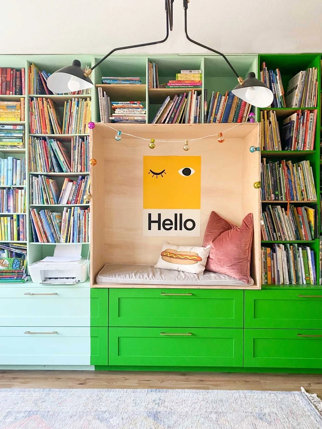 bold yellow wall print with word Hello hanging in a bookshelf nook