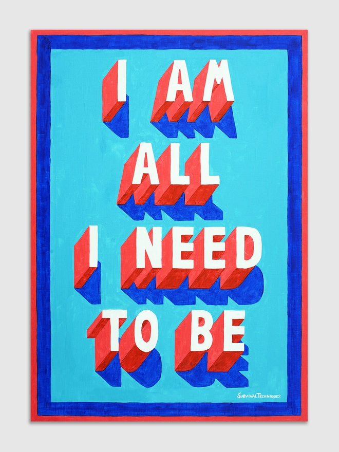 Unframed typographic art print displayed against a light grey background. The artwork features the phrase "I AM ALL I NEED TO BE" in bold, three-dimensional red and white lettering with deep blue shadows. The text sits on a bright turquoise background, bordered by red and blue edges. The piece is signed “Survival Techniques” in the bottom right corner.