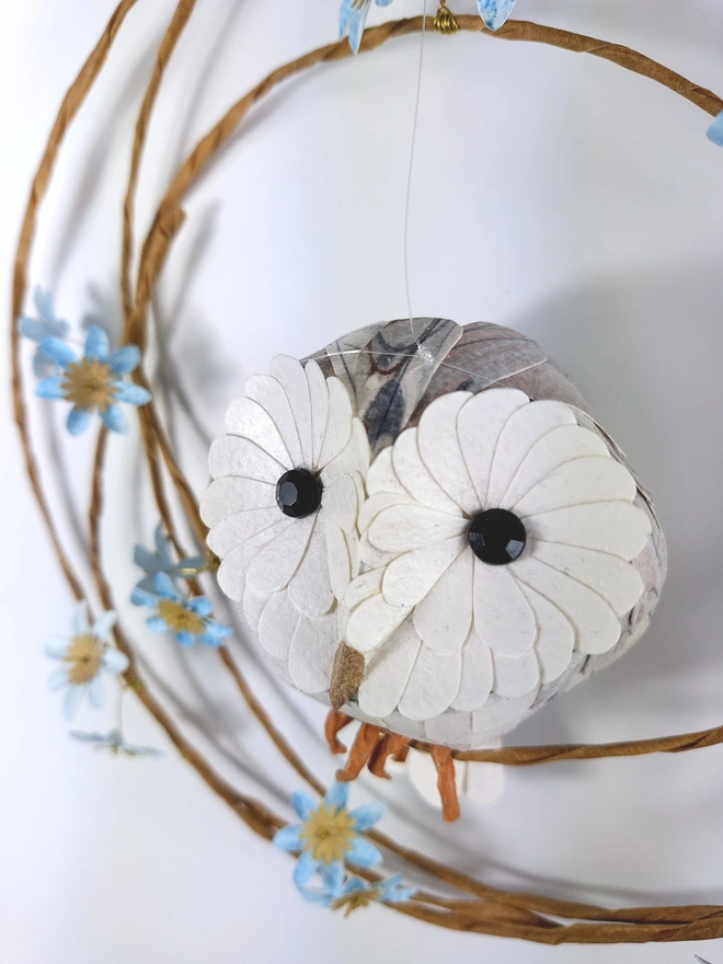 close up of a baby barn owl  handmade sculpture