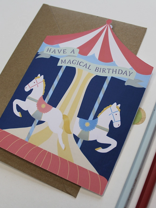 Carousel Circus Birthday card with two horses on a merry go round