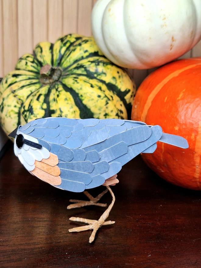 Handmade bird sculpture depicting a nuthatch