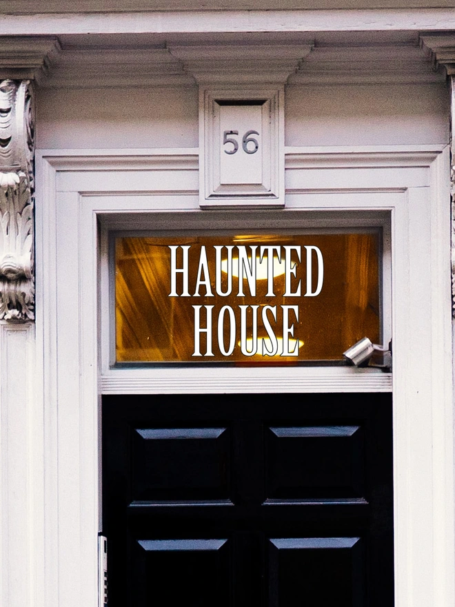 white and black haunted house wall sticker