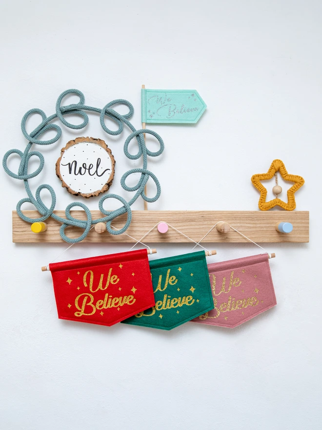 "We Believe" christmas banners in a range of colours