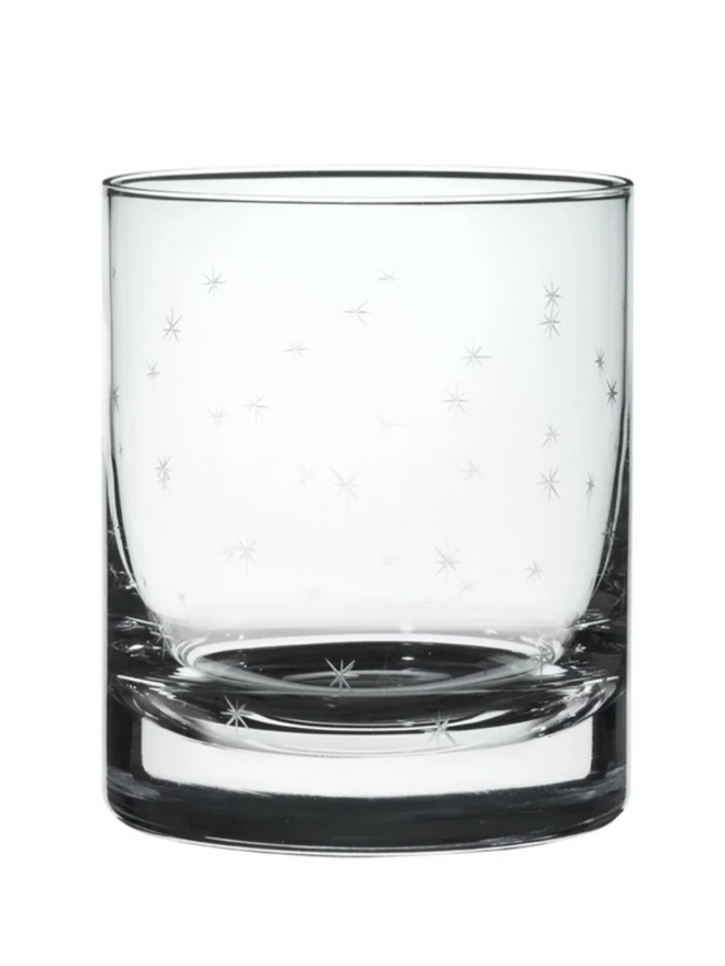 engraved stars crystal whisky glasses. a drinks glass engraved with a detailed stars pattern.
