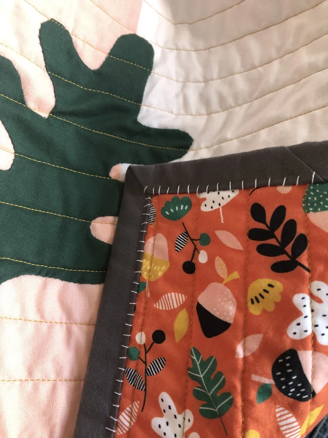 Autumn Leaf Design Print Back to Autumn Leaf Strip Baby Quilt/ Mat With Hand Stitched Edging.