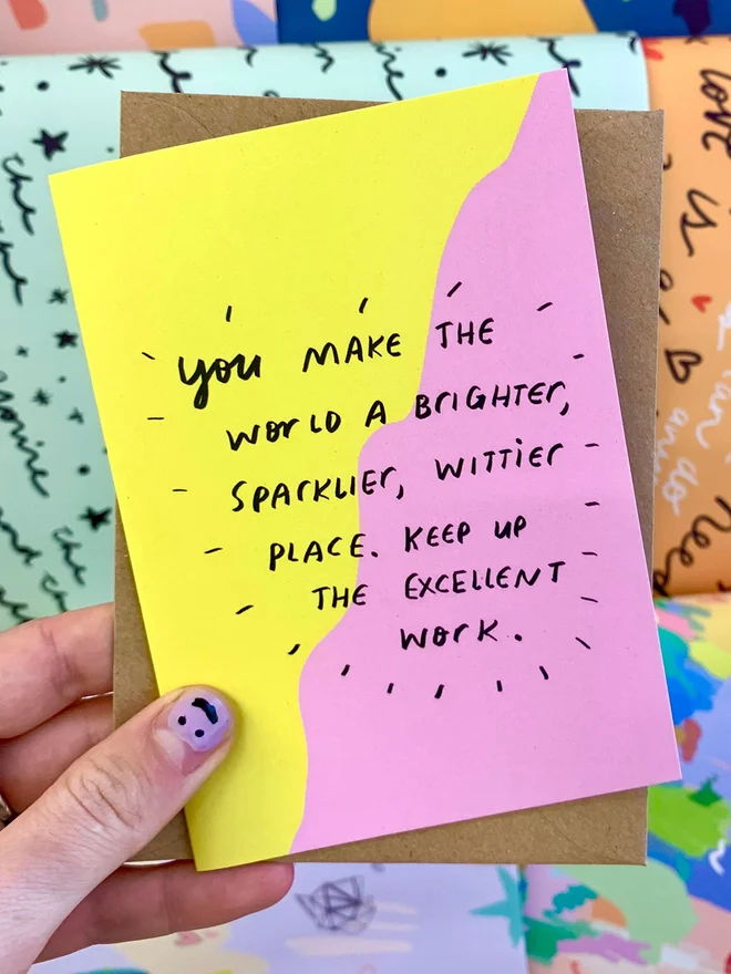 Card reads 'you make the world a sparklier, wittier place.' 