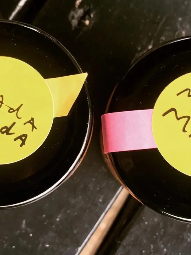 White Sesame Praline Spread, birds eye view of two lids. 