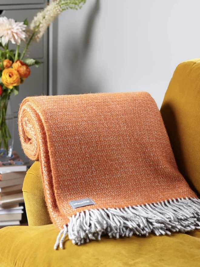 Organic Wool Throw, an organic wool throw sitting on a sofa. 