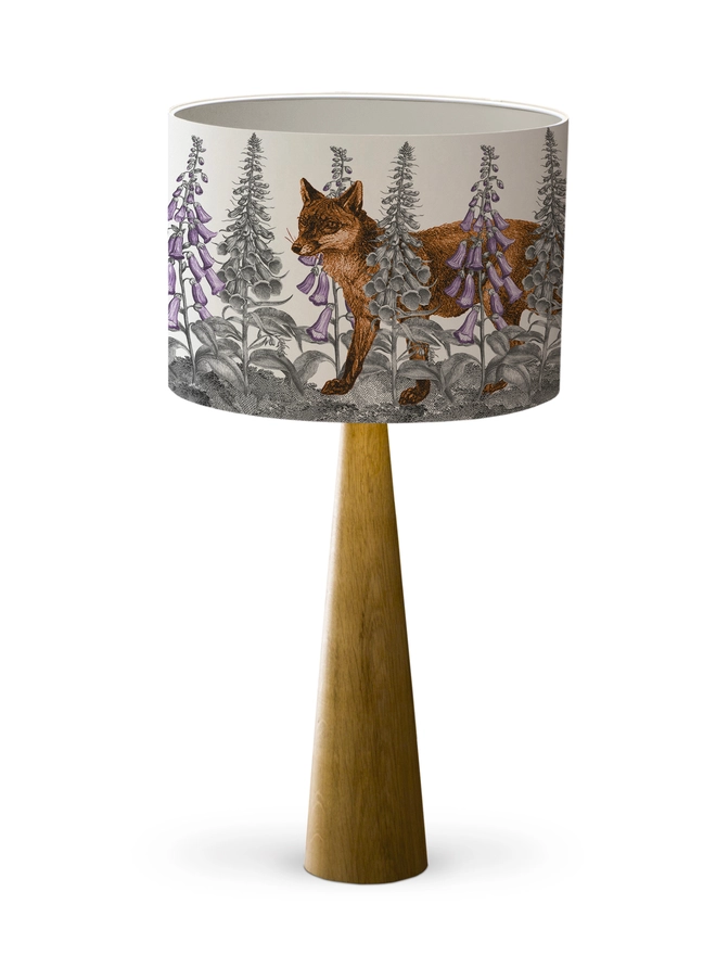 Handmade lampshade featuring a mischievous fox moving through foxglove flowers in a whimsical woodland design.