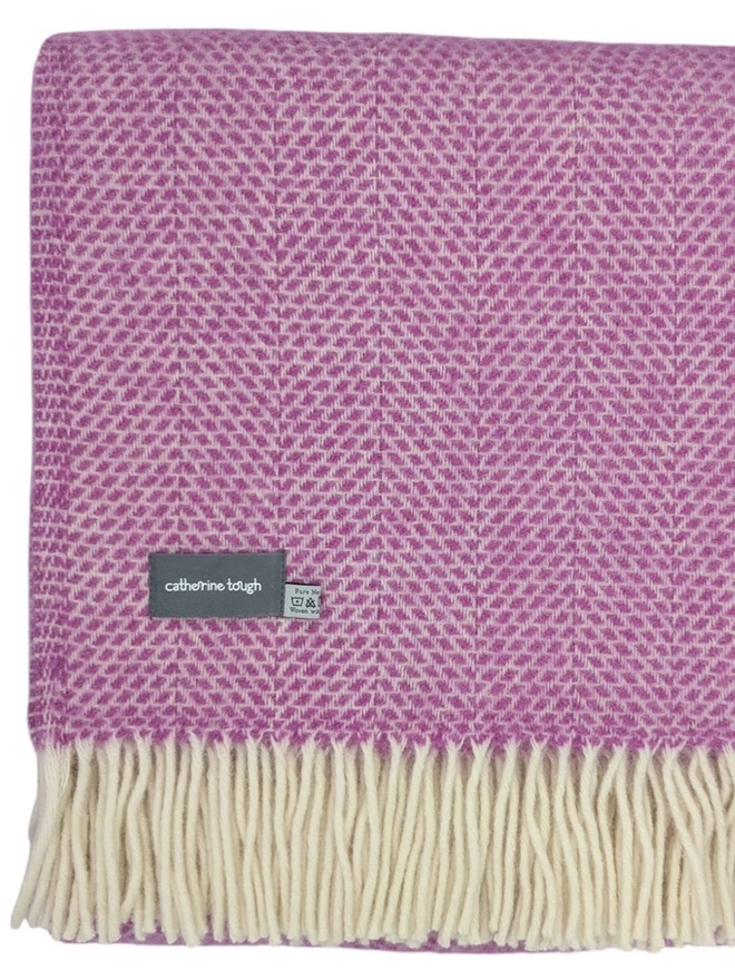 Organic Wool Throw, an organic wool throw folded on a white surface. 