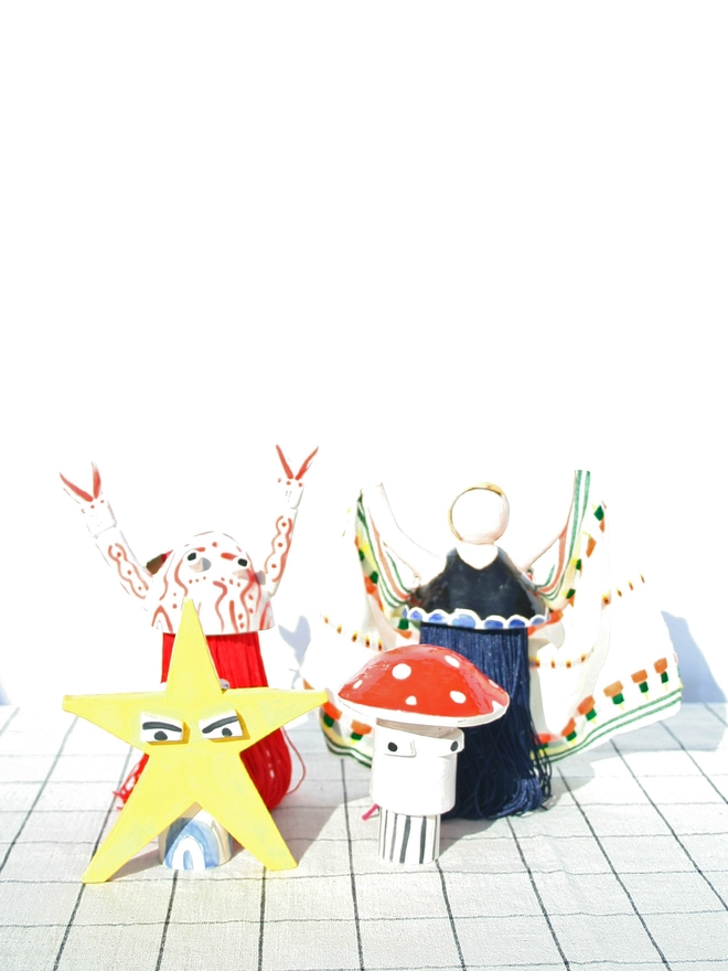 ceramic christmas tree toppers. star, lobster, swimmer and mushroom