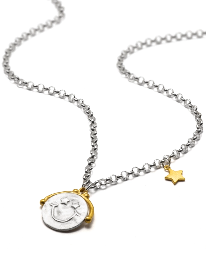 The Choose Happy Spinner Necklace is a sensory-friendly spinner pendant in sterling silver and gold plate. A meaningful piece of jewellery designed to calm anxious hands and encourage mindful moments.