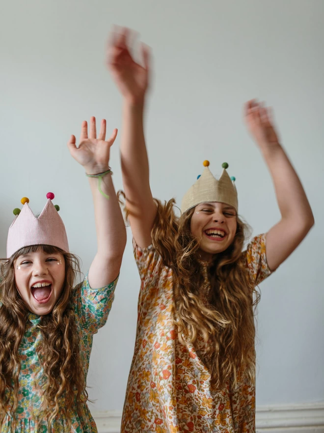 Two girls celebrating in their beautiful birthday crowns 