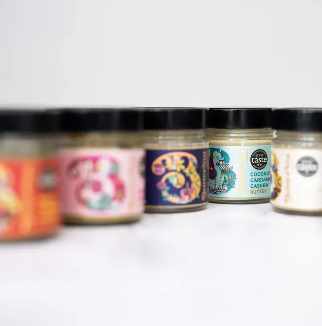 great taste gift box. five jars of nut butter lined up, photographed against a white marble backdrop.