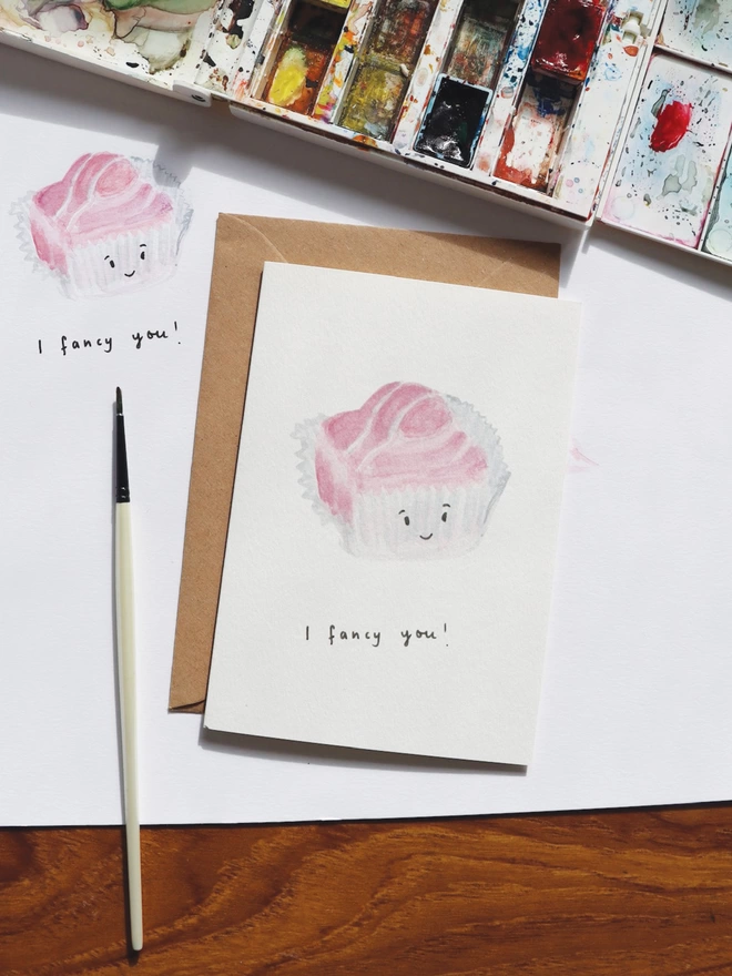 I Fancy You Greeting Card has a Pink French Fancy Cake with a smiley face the card reads I Fancy You  