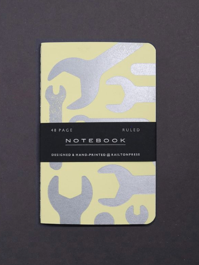 Lined Spanner Pocket Notebook. A notebook in pastel yellow