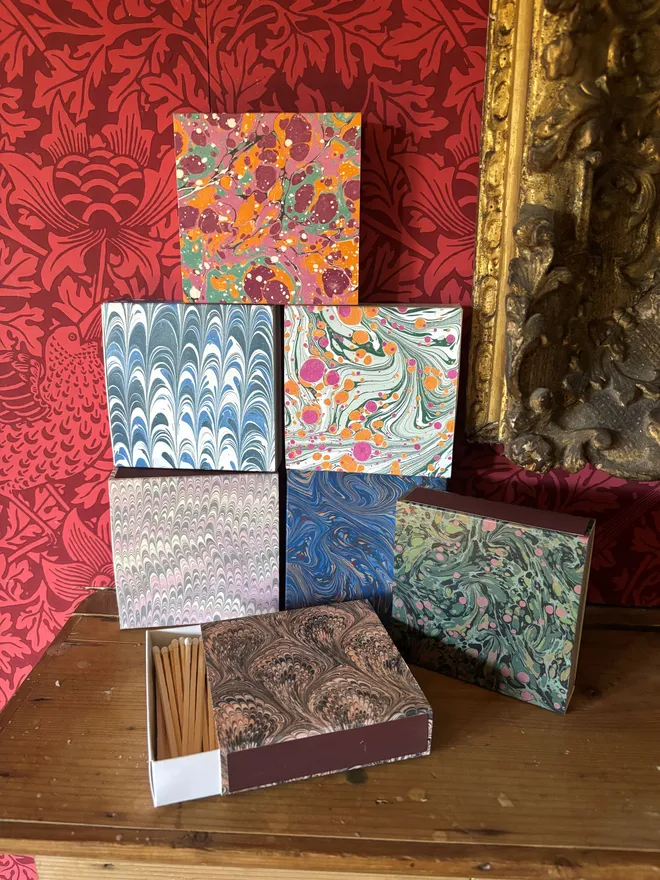 Group shot of  marbled square matchboxes