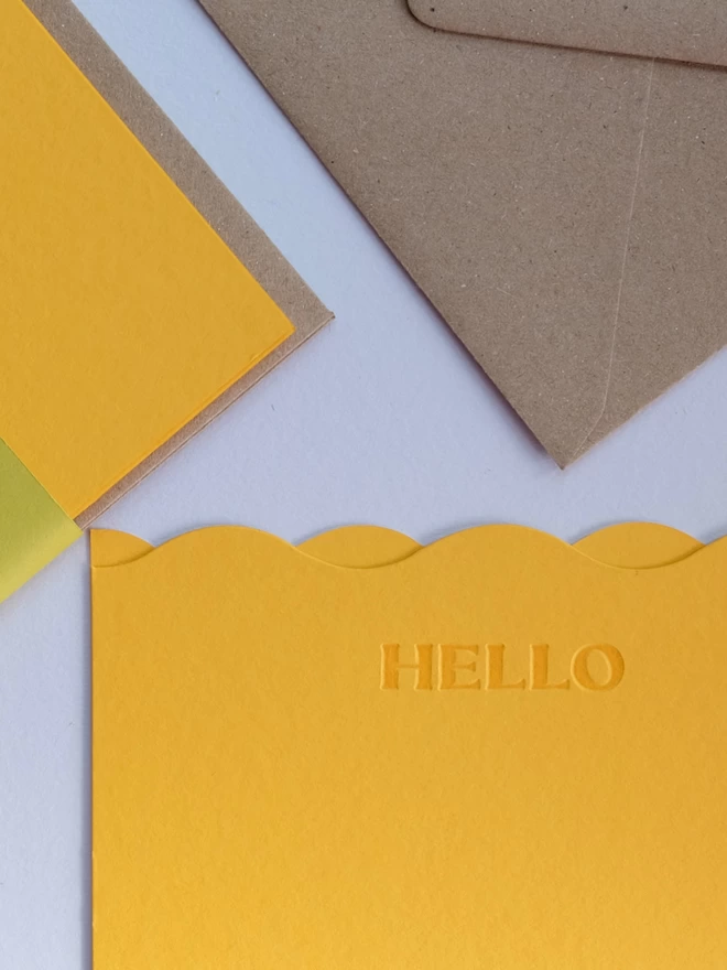 Set of 'Hello' yellow notecards with Kraft envelope.